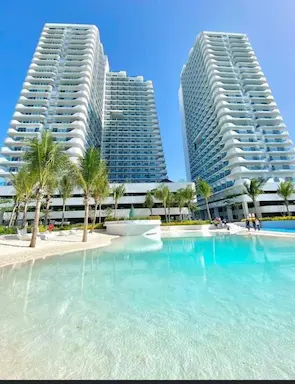 Azure North man-made beach - white sand shoreline and crystal clear lagoon waters